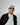 Model wearing RSKF DENVAH Black and Natural hats in lifestyle photoshoot